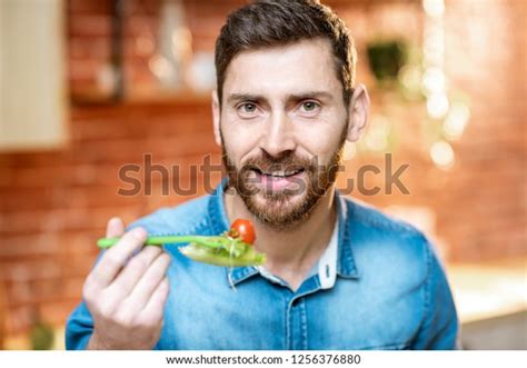 Closeup Portrait Handsome Man Eating Healthy Stock Photo 1256376880