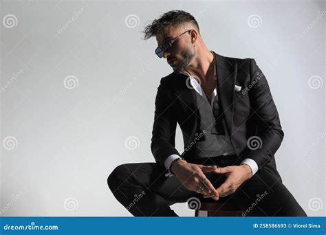 Bearded Man Wearing His Collar Shirt And Bowtie Open And Posing Stock