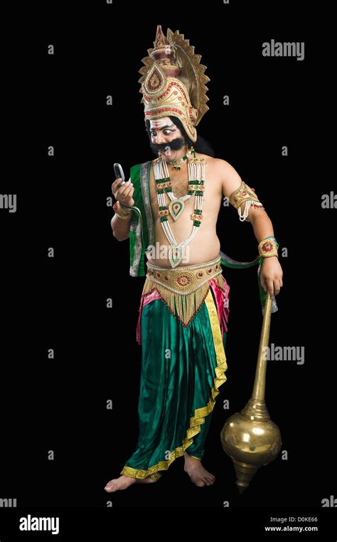 Man Dressed Up As Ravana Reading Text Message Stock Photo Alamy