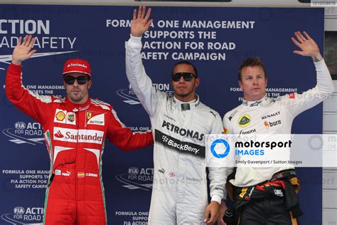 L To R Fernando Alonso Esp Ferrari Pole Sitter Lewis Hamilton