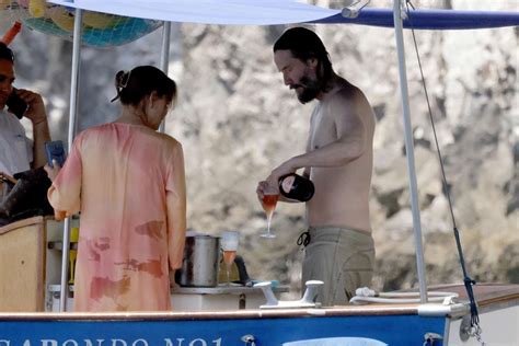 Shirtless Keanu Reeves Lounges On A Boat In Italy See The Photos