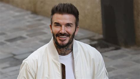 David Beckham Is Seen Clutching Six Bottles Of Stella Artois As He