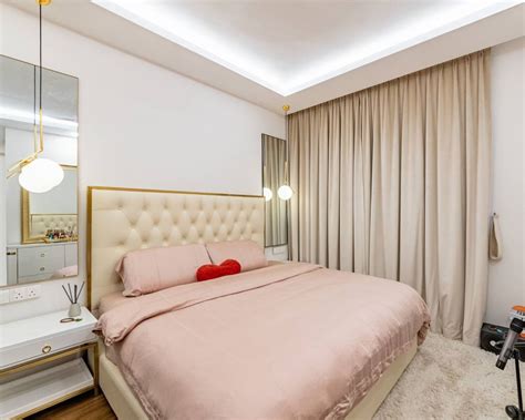 Pink And Beige Master Bedroom Design With White Side Table And Dressing