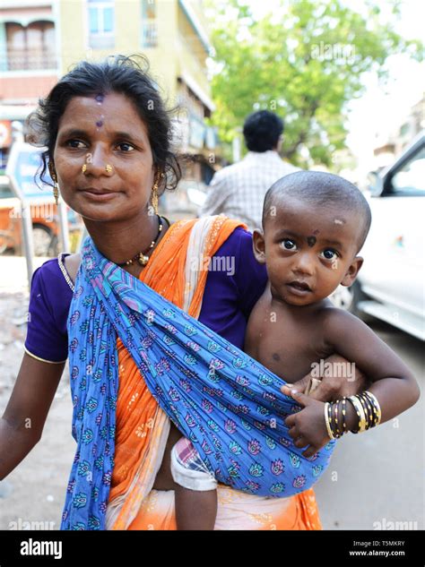 A beggar with her baby in South India Stock Photo - Alamy