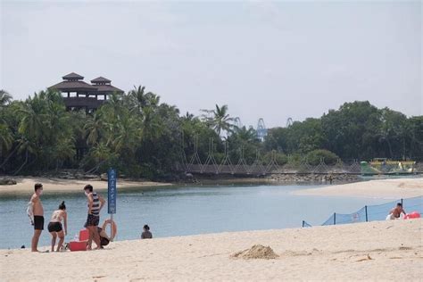 Sparse crowds at Sentosa beaches on first day with online booking requirement | The Straits Times