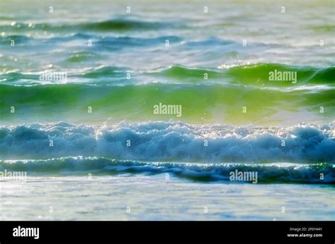 Incoming Whitewater Waves Breaking Onto A Beach Stock Photo Alamy