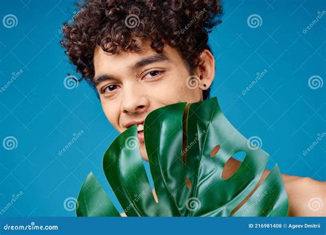 Handsome Man With Curly Hair Naked Shoulders Green Leaf Clear Skin