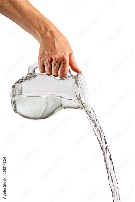 Hand Pouring Water From Glass Pitcher Stock Photo Adobe Stock