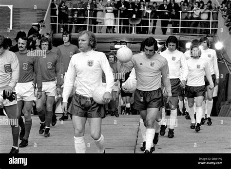 England captain Bobby Moore leads out his teammates before the match ...