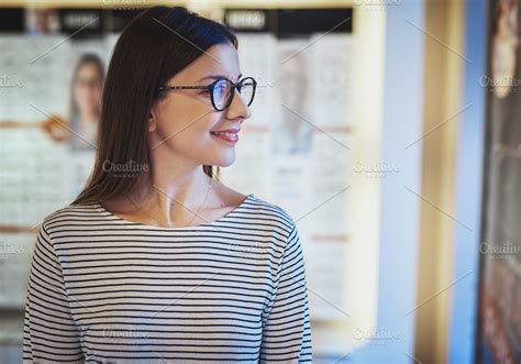 Young Woman Looking Sideways In New Eyeglasses High Quality People Images ~ Creative Market