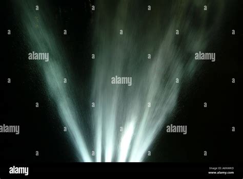 Water fountain by night Stock Photo - Alamy