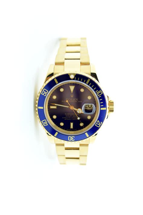 18k Yellow Gold Rolex Submariner 16618 Blue Dial Blue Bezel Used And New Howard Frum Jewelers