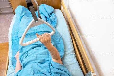 hand of sick woman holds handle of hospital bed 20299465 Stock Photo at ...