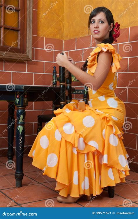 Woman In Traditional Flamenco Dresses Dance During The Feria De Abril