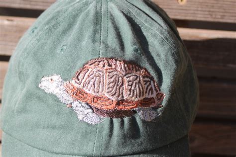 A Turtle Tortoise Is Embroidered On A Baseball Hat Cap Adjustable Hat