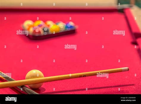 Red Billiard Table With Balls And Cue Sticks Stock Photo Alamy