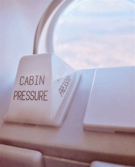 A Close Up Of A Computer Keyboard With The Word Cabin Pressure On It S Side