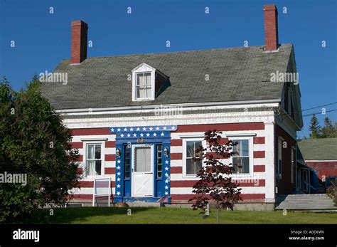 Old salt box style house in rural Maine painted in red white and blue ...