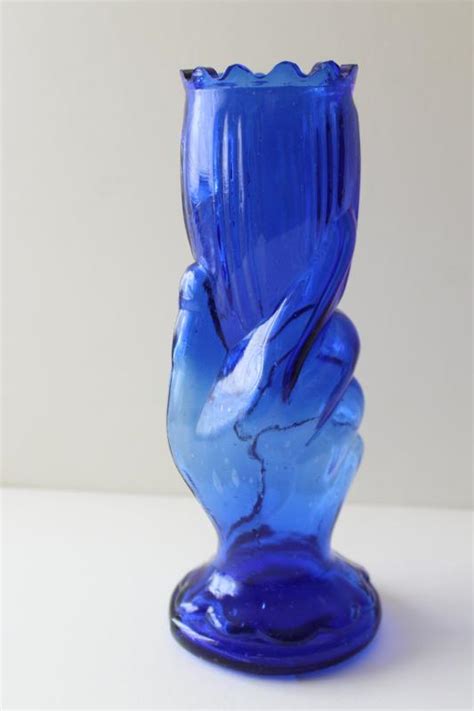 Vintage Cobalt Blue Glass Vase Ladys Hand Holding Trumpet Shaped Flower