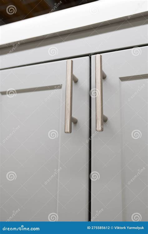 Kitchen cabinet handles stock photo. Image of indoors - 275585612