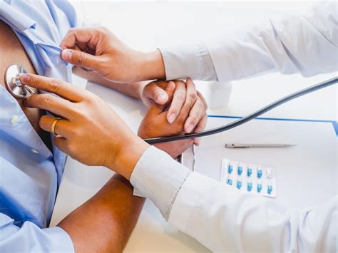 Premium Photo Cropped Hands Of Doctor Examining Patient With Stethoscope