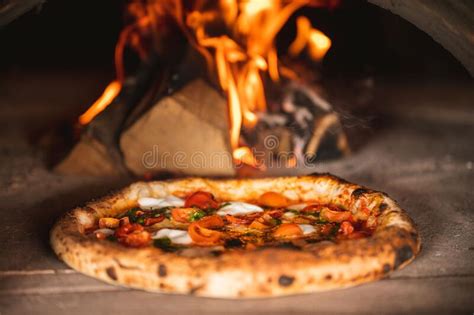 Closeup Shot Of A Neapolitan Pizza In A Wood Fired Pizza Oven Stock