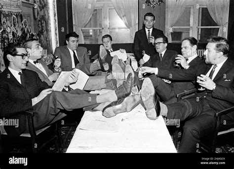 Sitting around the table are comedy writers (L-R) Denis Norden, Frank ...