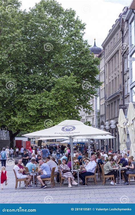 Many Tourists in Street Restaurants in the Old Town of Munich Editorial ...