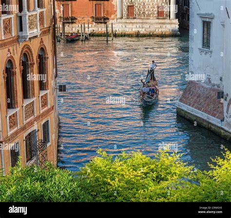 Gondola On The Grand Canal Turning Into A Side Canal In Dorsoduro