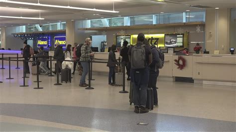 Customers Wait In Long Lines For Rental Cars At Jax