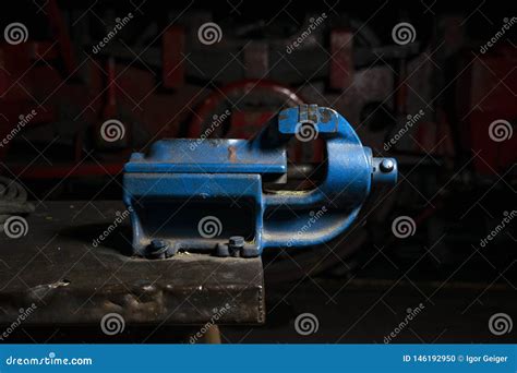 Blue Metal Mechanical Vise Mounted On A Workbench In The Repair Shop ...