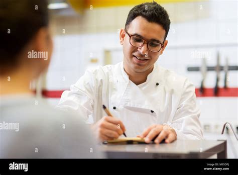 Chef At Fast Food Restaurant Writing Order Stock Photo Alamy