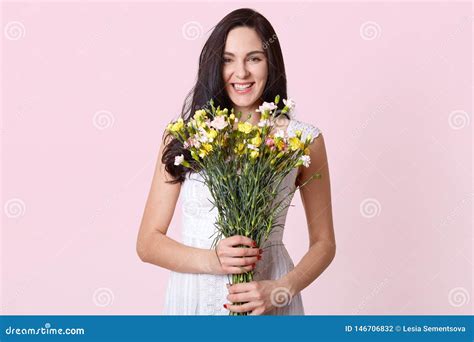 Image Of Girl Holding Bouquet Of Flowers In The Hands Chorming Lady