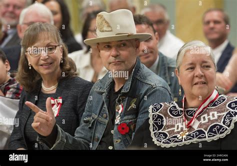 Tragically Hip Singer Good Downie Raises His Arm In Response To A Speaker As He Sits With Sylvia