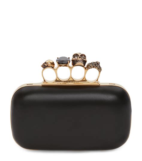 Womens Alexander McQueen Black Skull Four Ring Clutch Bag Harrods US