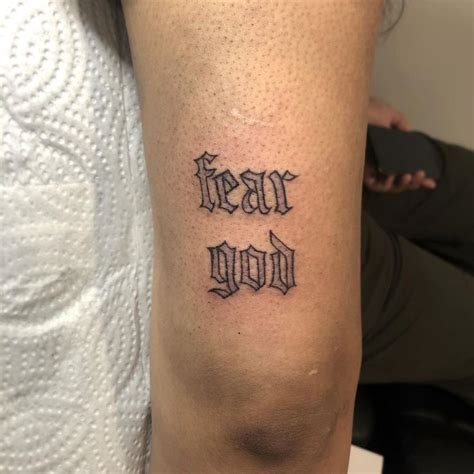 Exploring The Allure And Meaning Behind The Fear God Thigh Tattoo