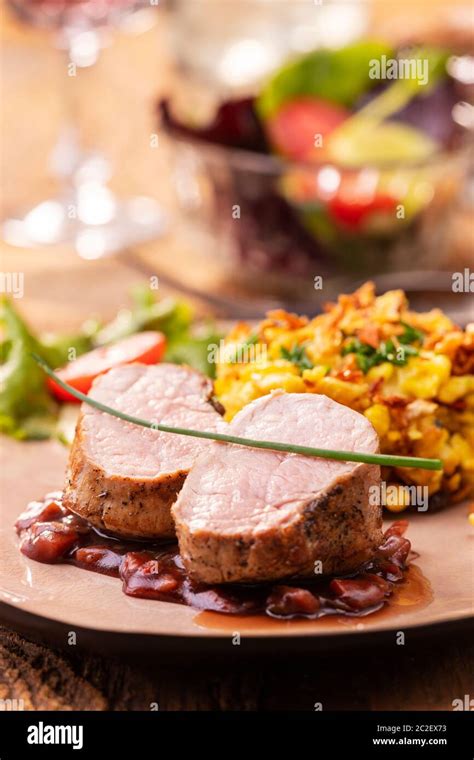 Swabian Pork Fillet With Spaetzle On Wood Hi Res Stock Photography And