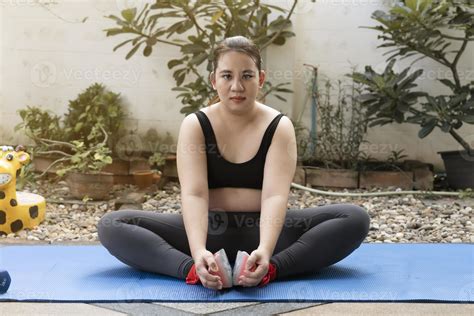 Beautiful fat woman resting after yoga and exercise at home. balance ...