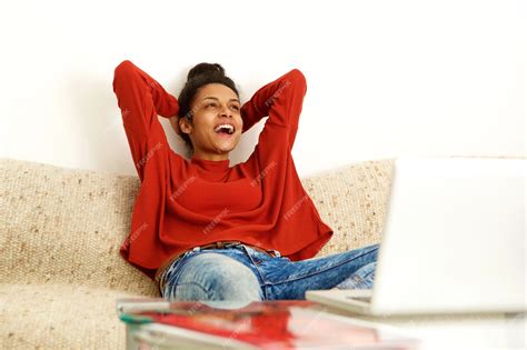 Premium Photo Young Woman With Laptop Laughing At Home