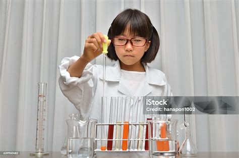 Japanese Girl Experiments In Science Stock Photo Download Image Now