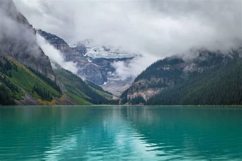 Misty Mountains Of Lake Louise Stock Photo By Focqus