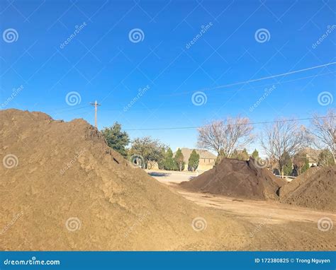 Large Heap Of Organic Topsoil Pile At Wholesale Compost Plant Near