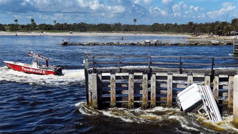 Five people rescued after two boats overturn in the Sebastian Inlet