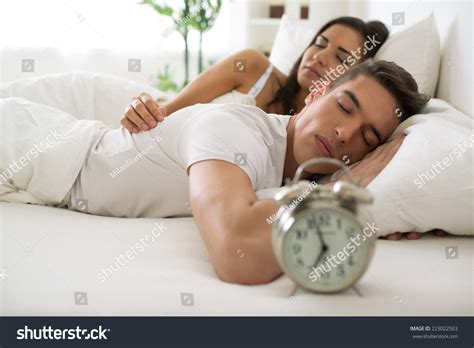 Young Hugging Couple Sleeping On Bed Stock Photo 223022503 | Shutterstock