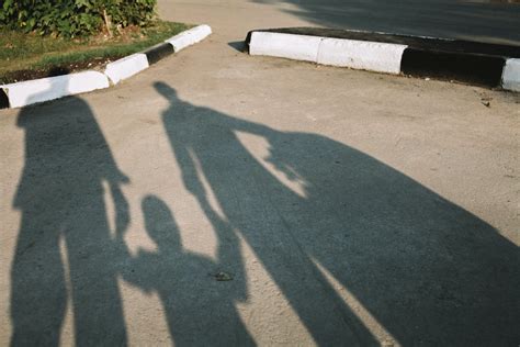 Shadows of People Holding Hands · Free Stock Photo