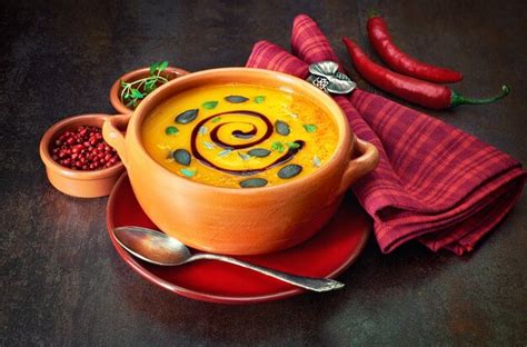 Premium Photo Spicy Pumpkin Creme Soup With Spices Around On Dark