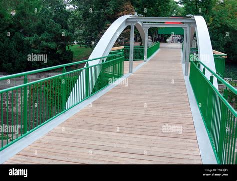 Pedestrian bridge with wooden floor . Footbridge in park of Vienna ...