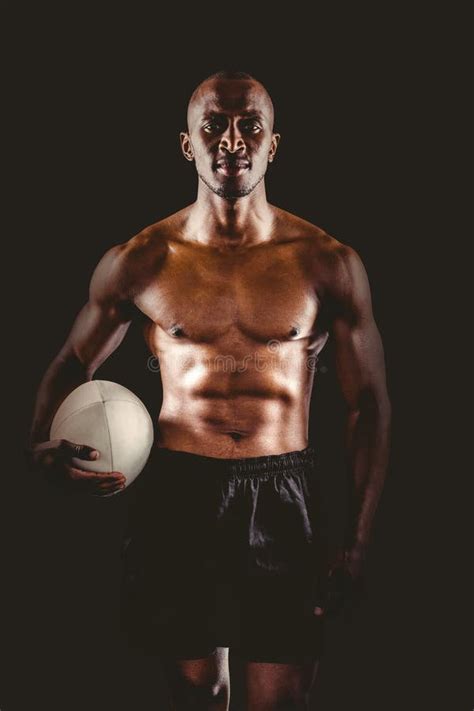 Portrait Of Shirtless Sportsman Holding Rugby Ball Stock Photo Image