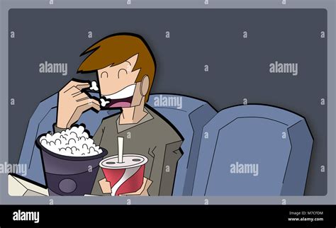 Boy Eating Popcorns In A Movie Theater Stock Photo Alamy