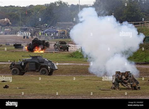 A WW2 Historical Battle Reenactment between German and American Reenactors and period Tanks ...